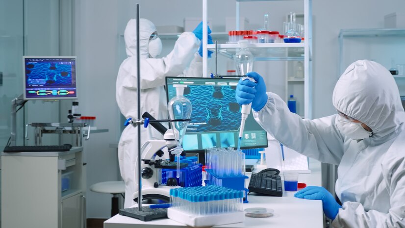 scientist-wearing-coverall-equipped-medical-laboratory-examining-drug-discovery-with-micropipette-biochemists-analysing-virus-evolution-using-high-tech-researching-vaccine-against-covid19_482257-3798